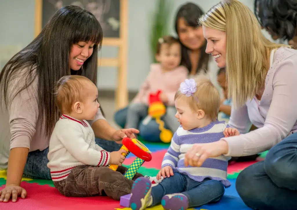 NDIS toddler participants playing with two speech pathologists during a speech therapy session, supporting toddler speech milestones and word count