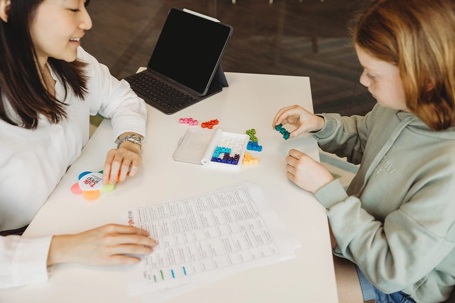 - A speech pathologist conducting an assessment