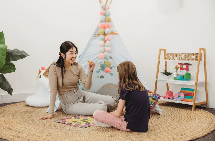 - A speech pathologist working on speech sounds with animal card prompts