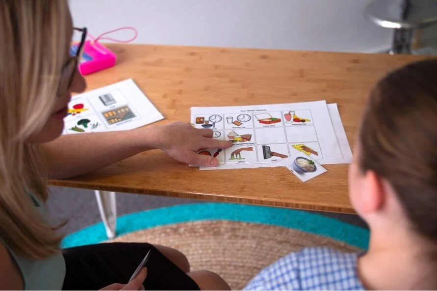 - Speech pathologist working with a child doing semantic therapy