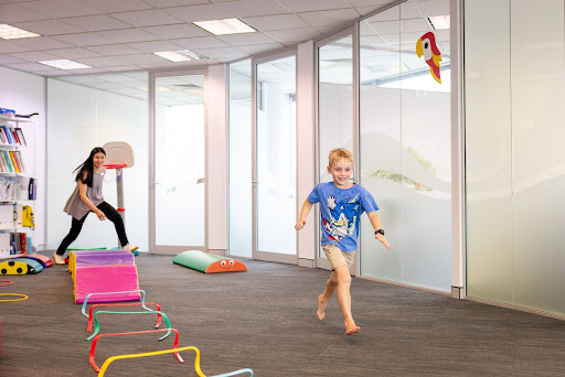 Child enjoying an active play session in the therapy space – Speech Pathology Ashfield.