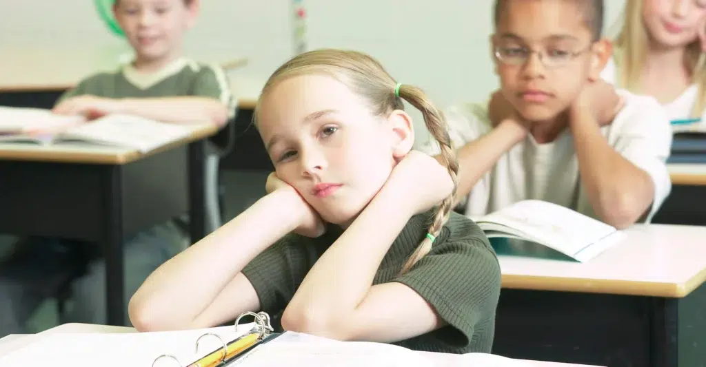 Custom Link Confused-girl-in-classroom-showing-signs-of-auditory-processing-disorder