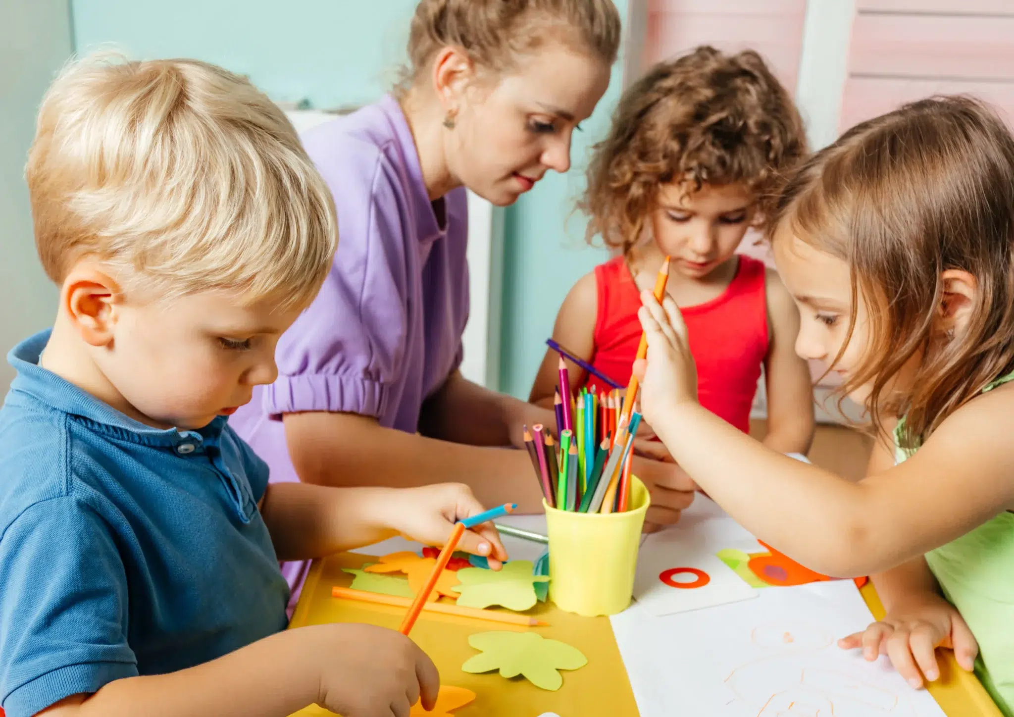 Neurodiverse affirming speech therapy encouraging communication, creativity, and self-expression through a drawing activity with three NDIS participants